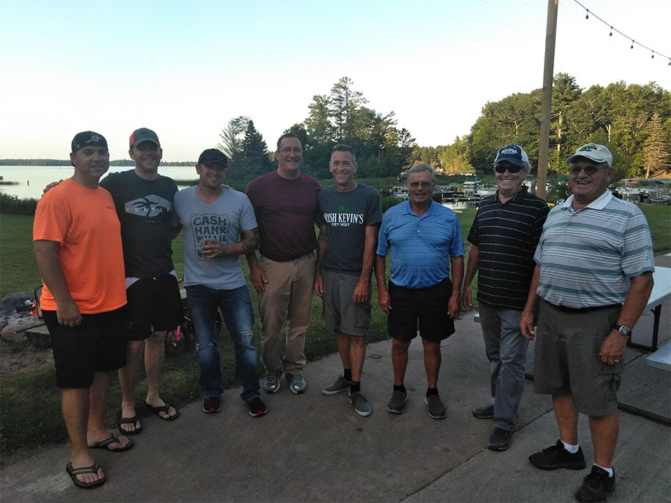 Group of men posing together for a photo