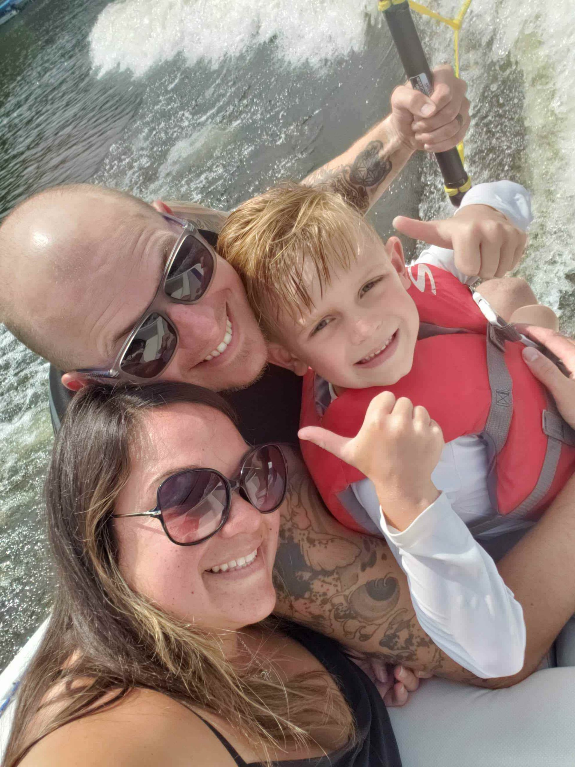 Parents and son on a boat ride