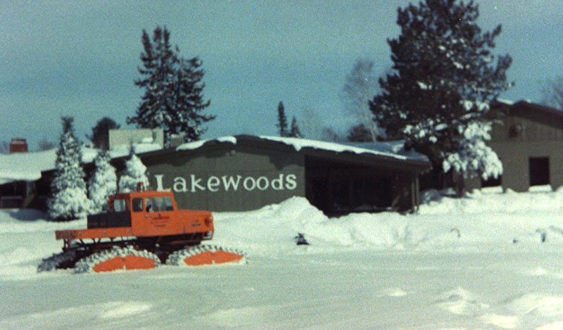 Historic photo of Lakewoods exterior with snowcat