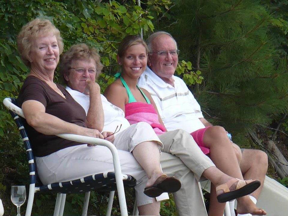 Family sitting on dock chairs