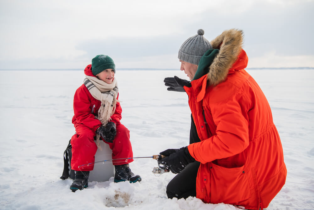 A father and son ice fishing